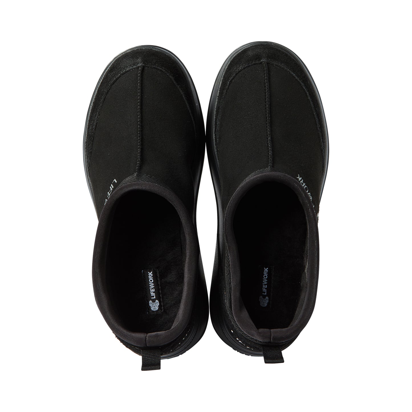 Pair of black slip-on shoes on a white background