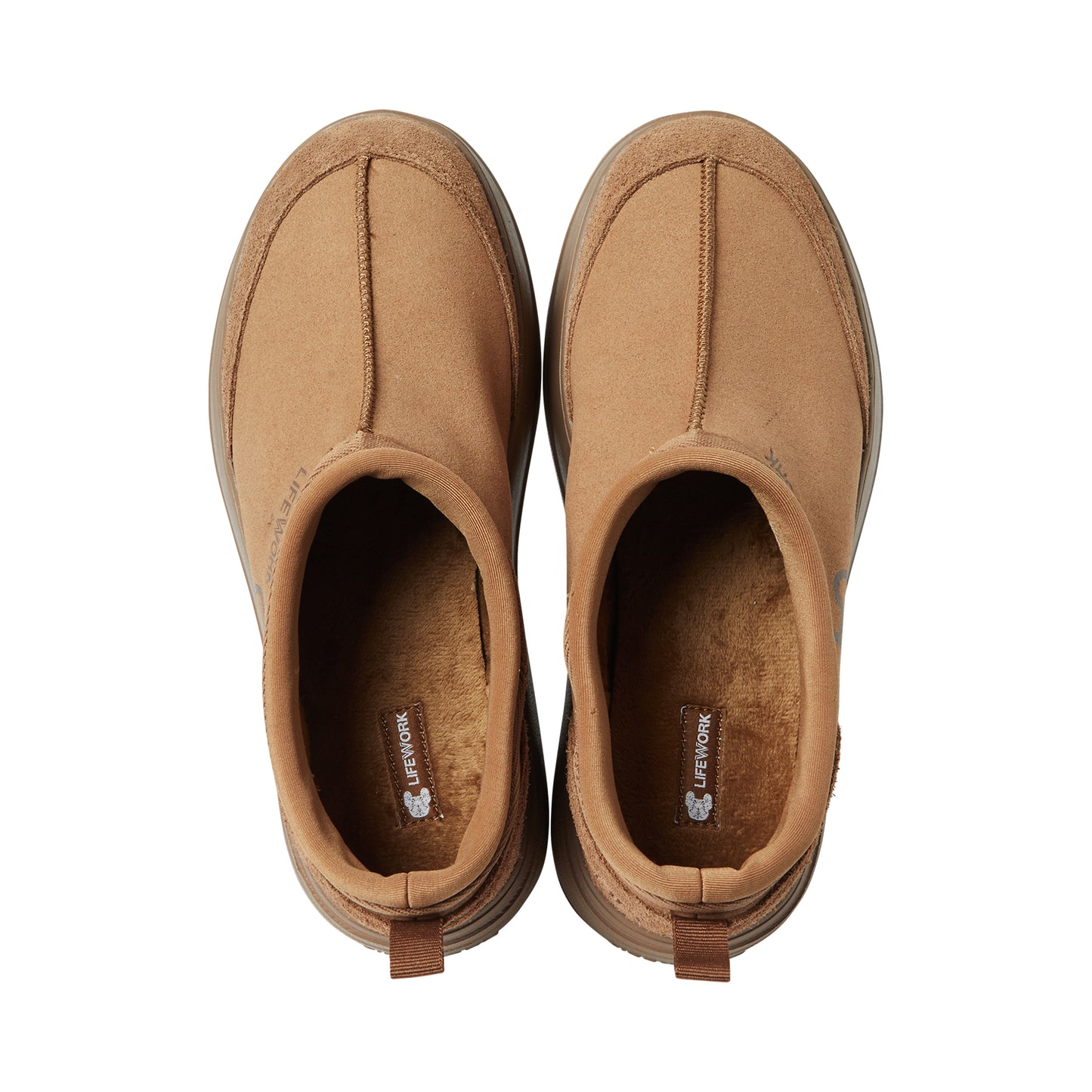 Pair of brown slip-on shoes on a white background