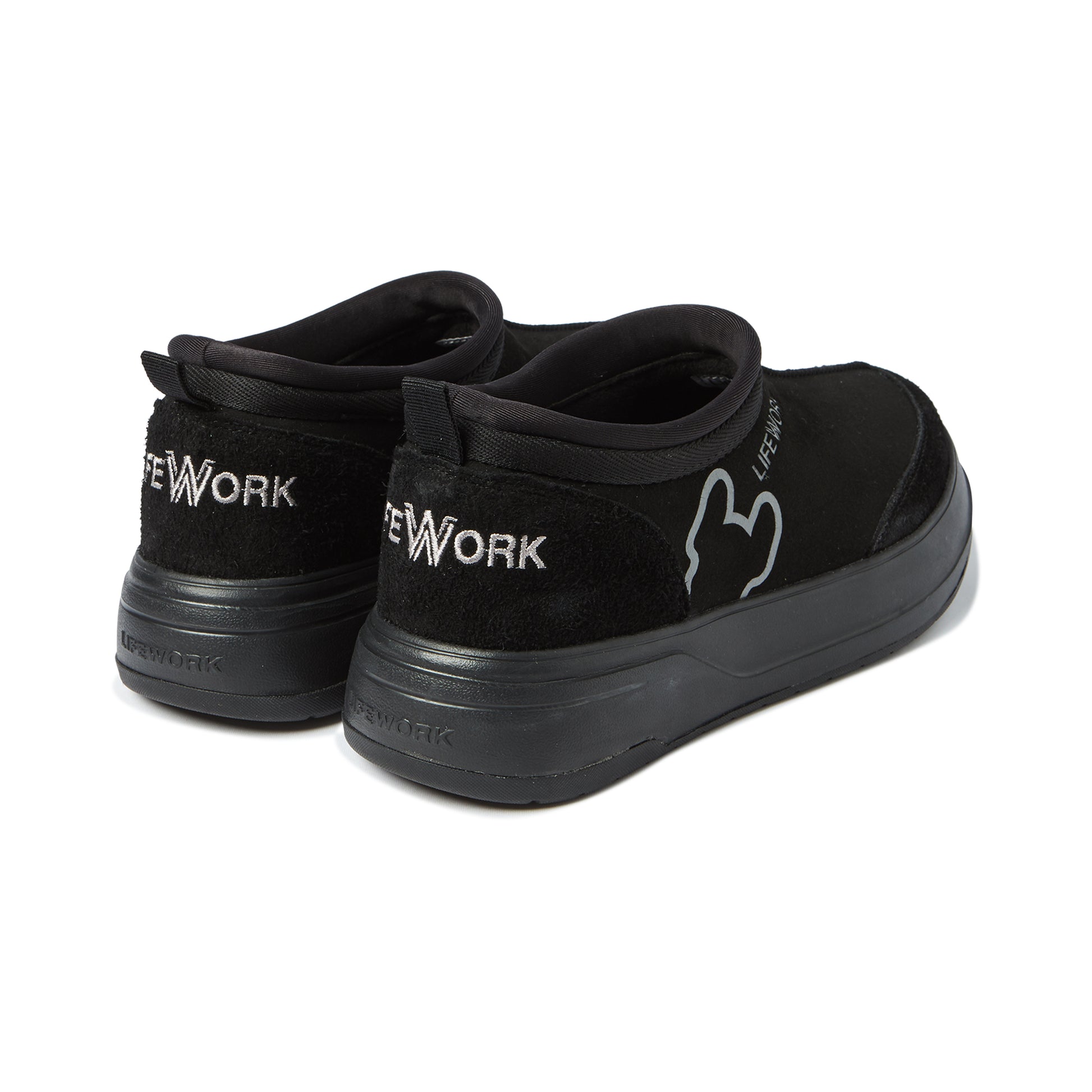 Black slip-on sneakers with 'New York' branding on a white background