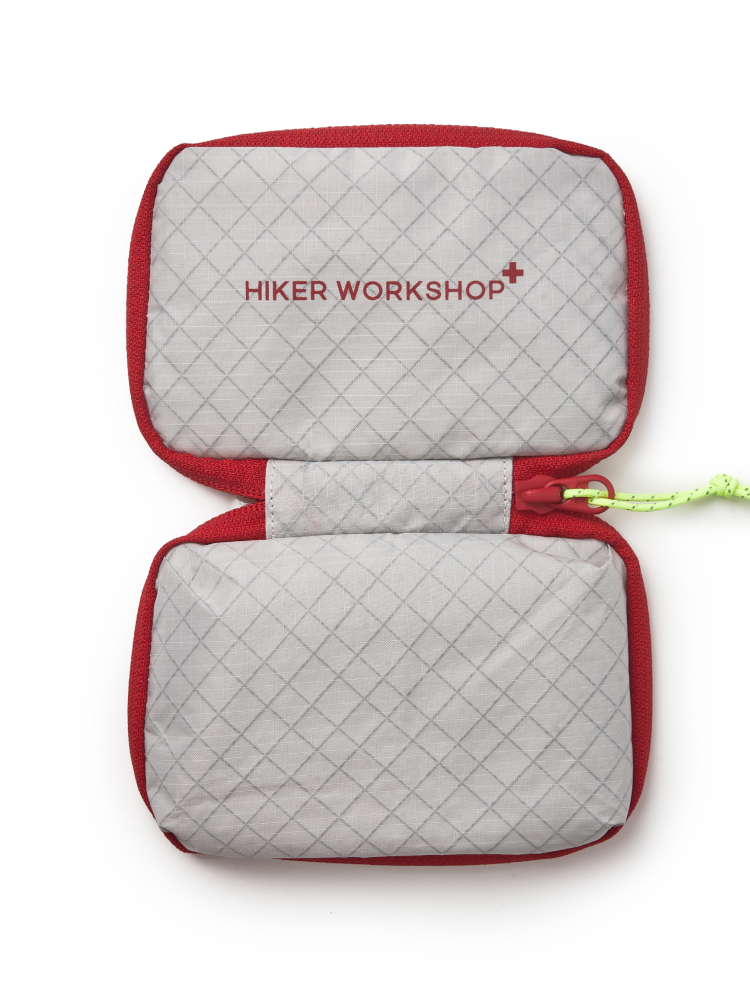 Quilted pouch with red border and Hiker Workshop logo