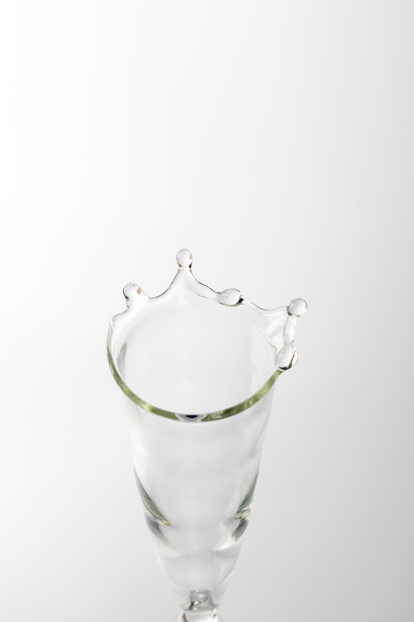 Top of Handmade champagne clear glass with water droplets 
