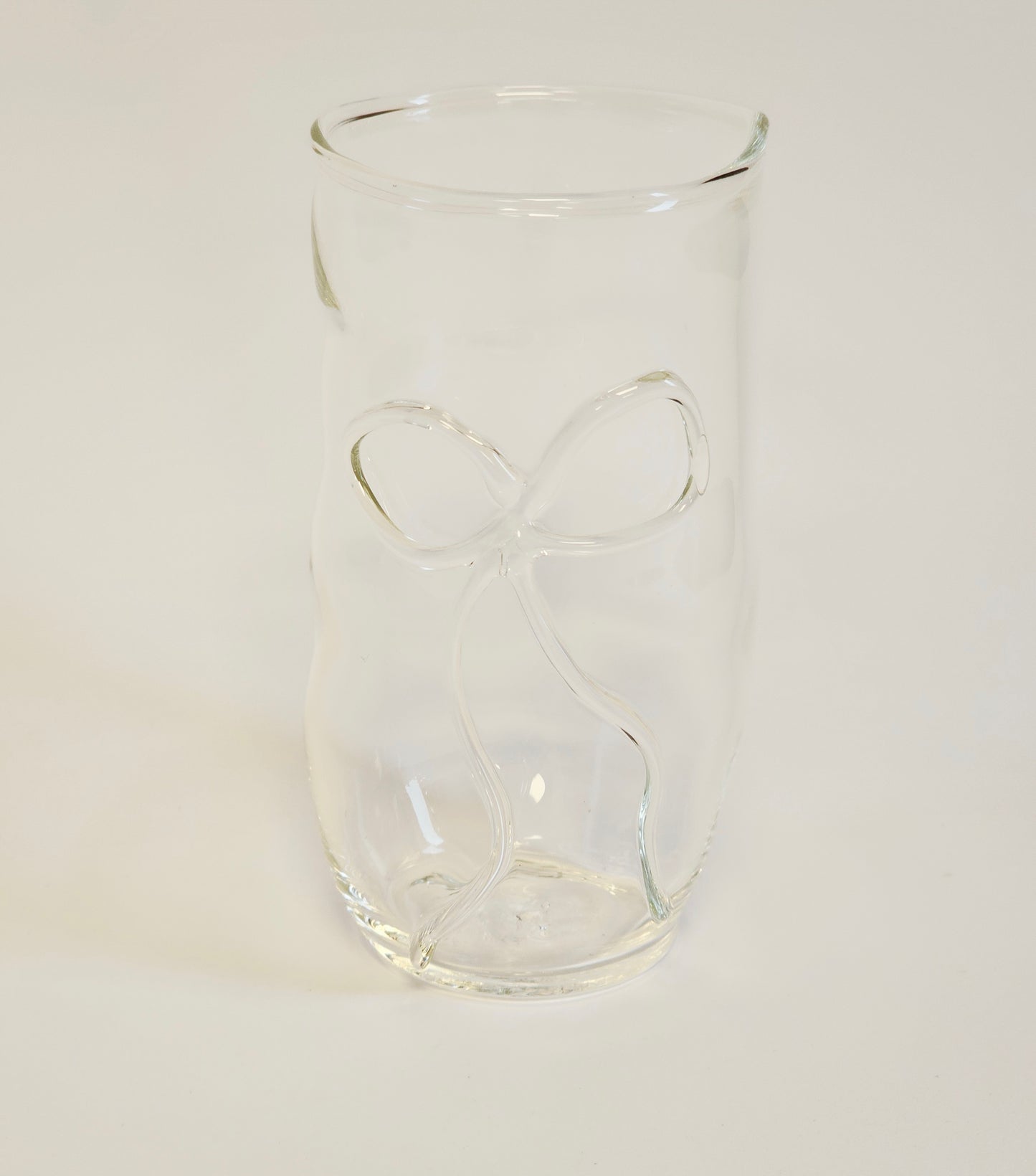 Handmade clear drinking glass with a ribbon