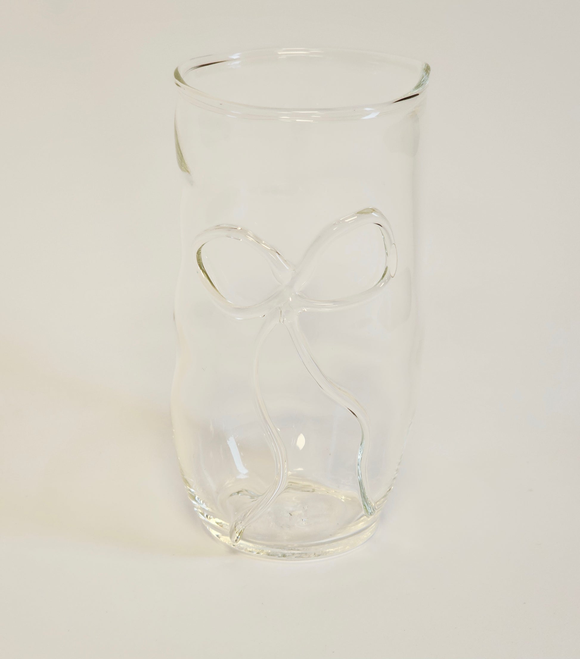 Handmade clear drinking glass with a ribbon