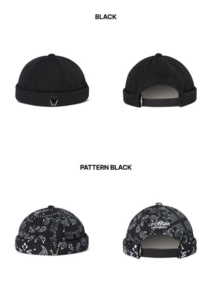Black cap with pattern on a white background
