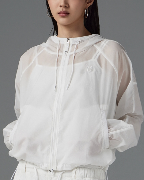 White sheer jacket worn by a person on a gray background
