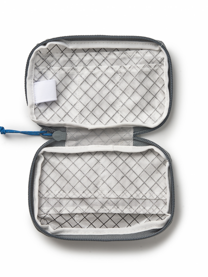 Open travel organizer pouch with grid pattern 